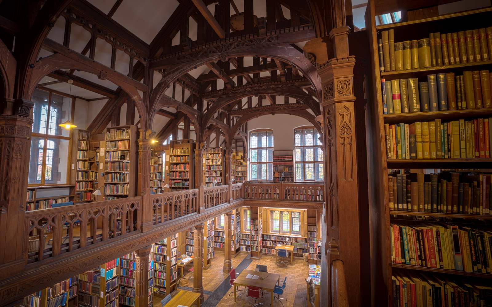 A wood-panelled library filled with old books