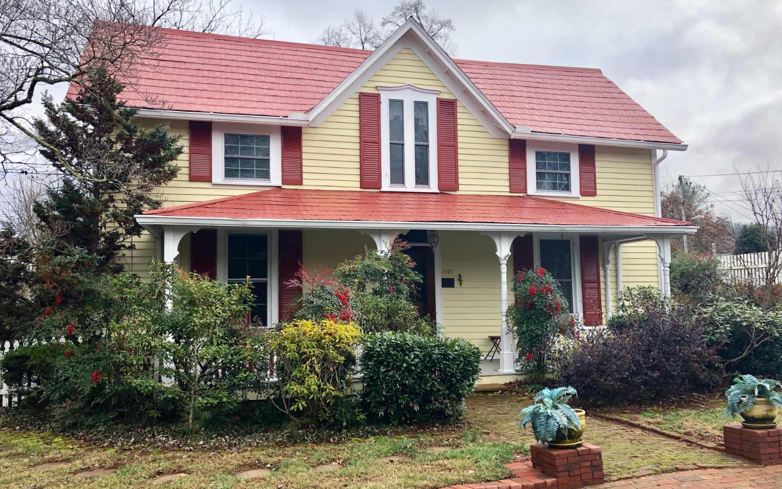 A renovated two-story house with a porch